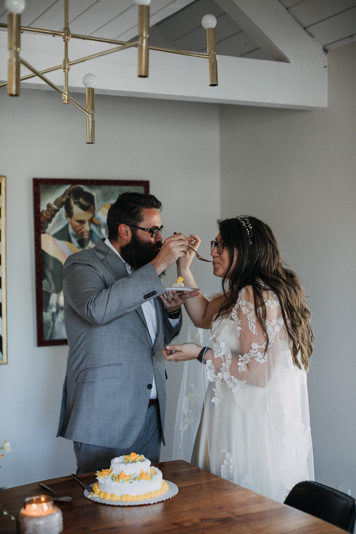 Sharing a slice of cake during the reception